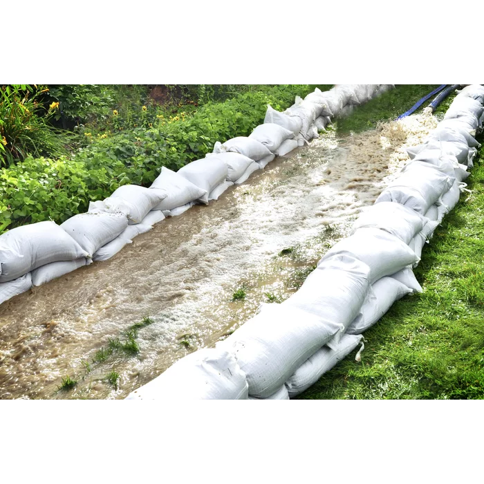 sand bags next to running water